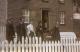 Mark Rowsell (far right) in front of his house.
